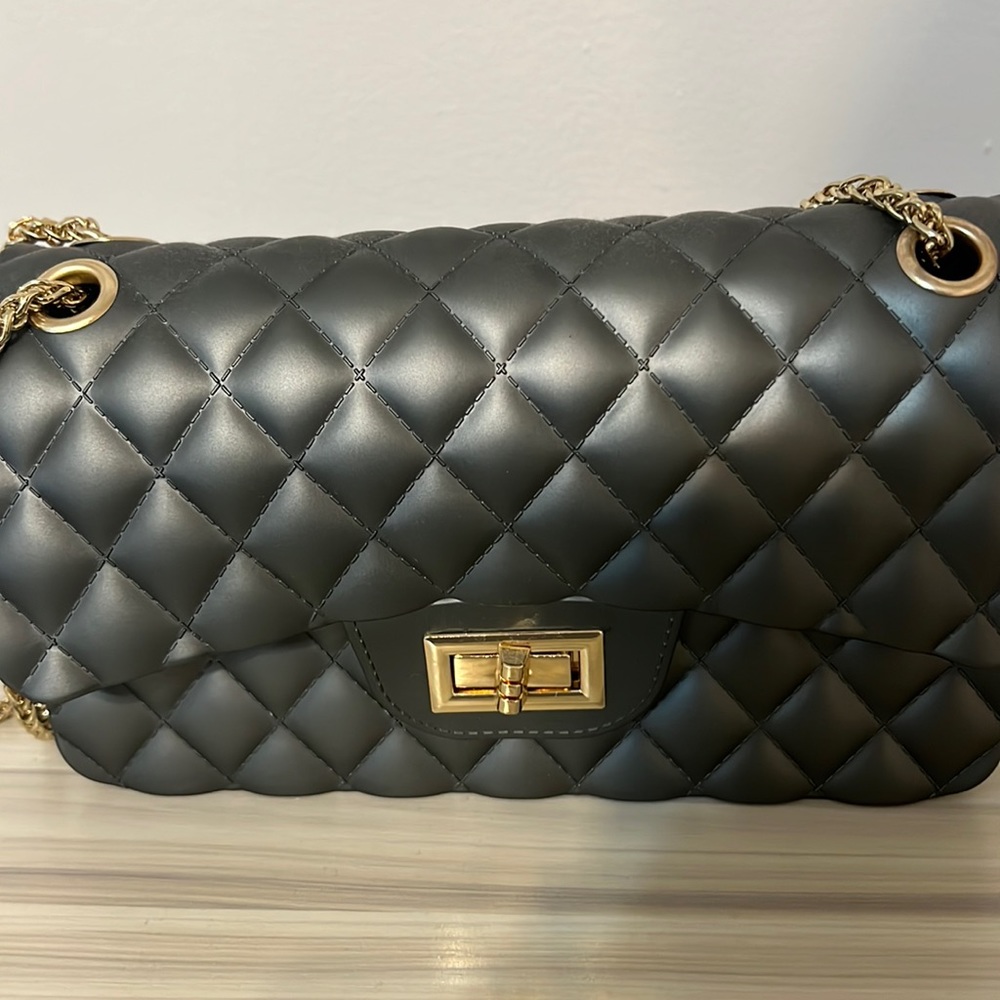 Small grey back with gold chains